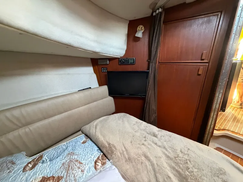 Slide: The Image of Interior of 2013 Ranger Tugs R-31 CB with bed and TV. - 49