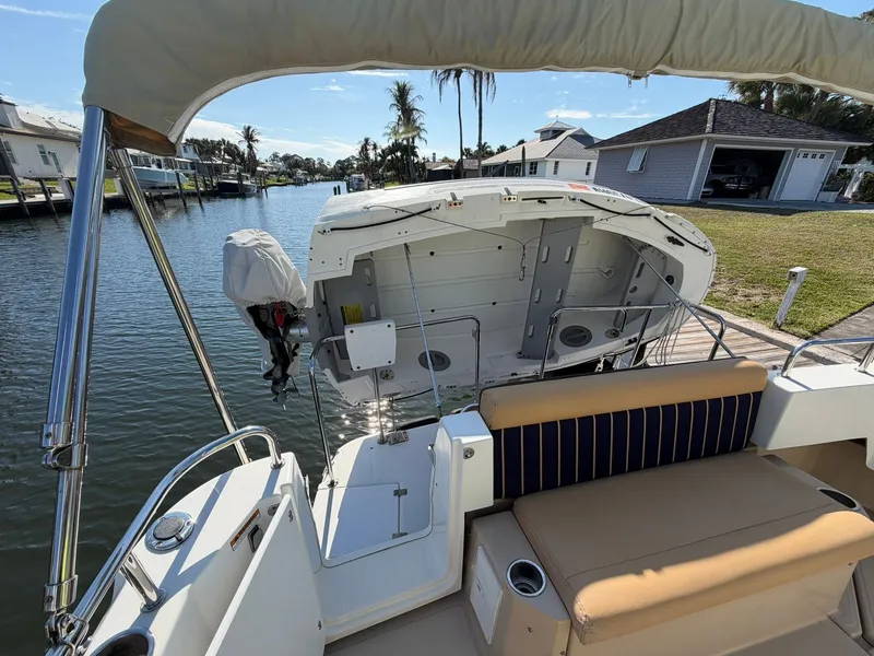Slide: The Image of 2013 Ranger Tugs R-31 CB on water with open stern hatch. - 6