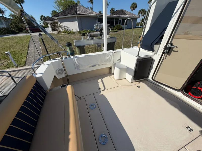 Slide: The Image of 2013 Ranger Tugs R-31 CB, spacious deck with seating area. - 7