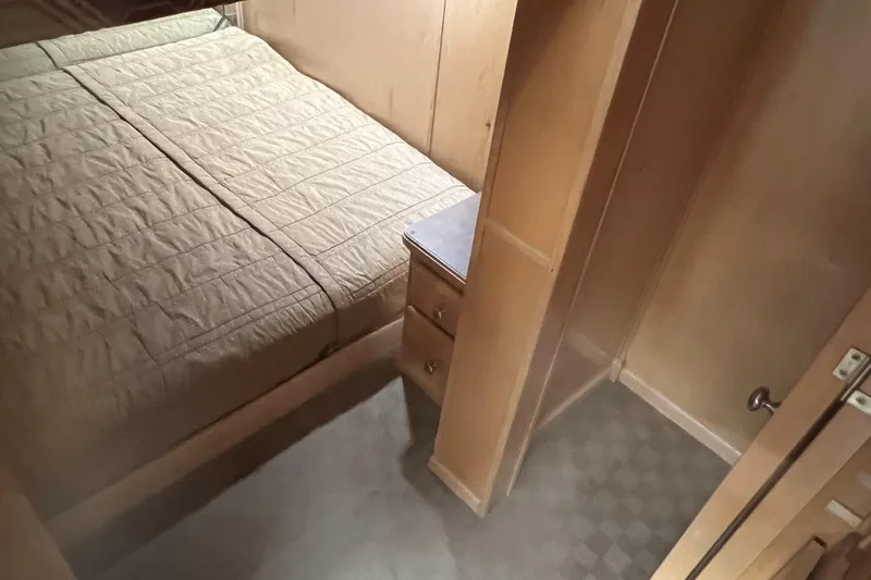 Slide: The Image of Cozy cabin interior of 2007 American Waterways Sundancer Trip #3, featuring a comfortable bed. - 17