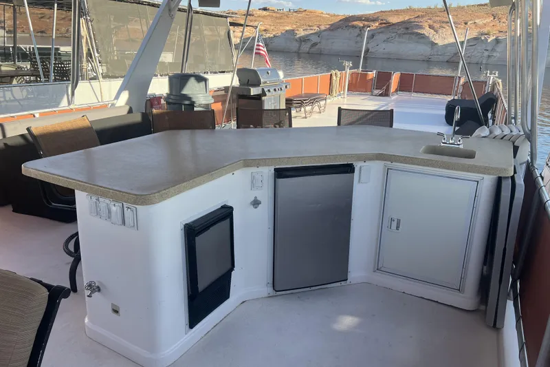 Slide: The Image of Outdoor boat kitchen with countertop, sink, and mini fridge on American Waterways Sundancer Trip #3. - 26