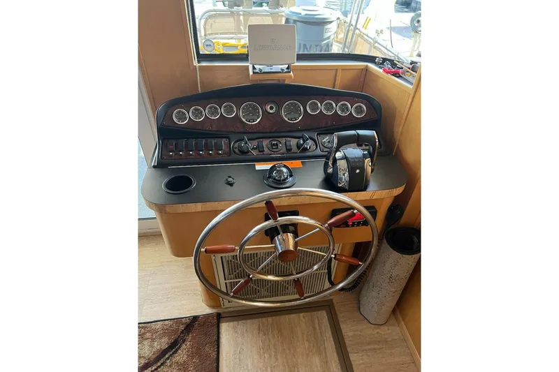 Slide: The Image of Helm of 2007 American Waterways Sundancer Trip #3 boat with steering wheel and controls. - 5