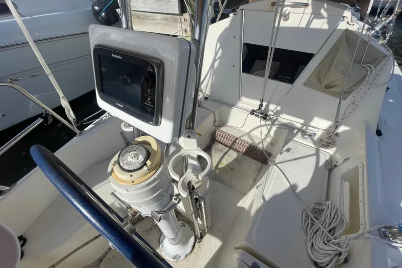 Slide: The Image of Cockpit of 2013 Hake Seaward 26RK sailboat with navigation equipment and steering wheel. - 14