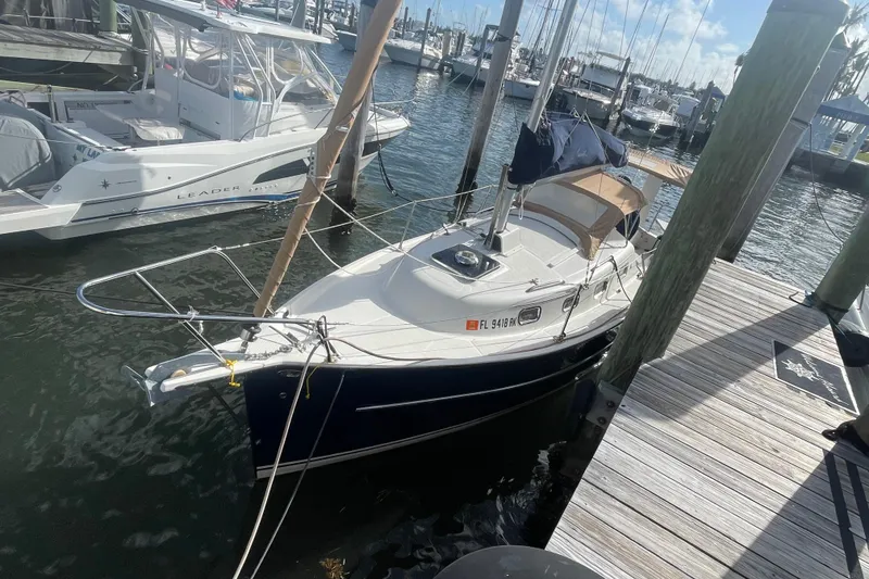 Slide: The Image of 2013 Hake Seaward 26RK sailboat docked at a marina, sunny day. - 2