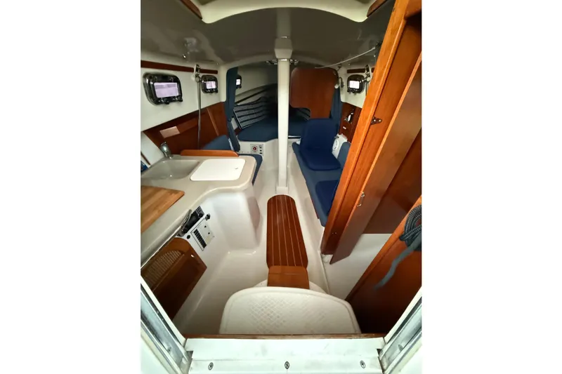 Slide: The Image of Interior of a 2013 Hake Seaward 26RK yacht with wood finishes. - 26