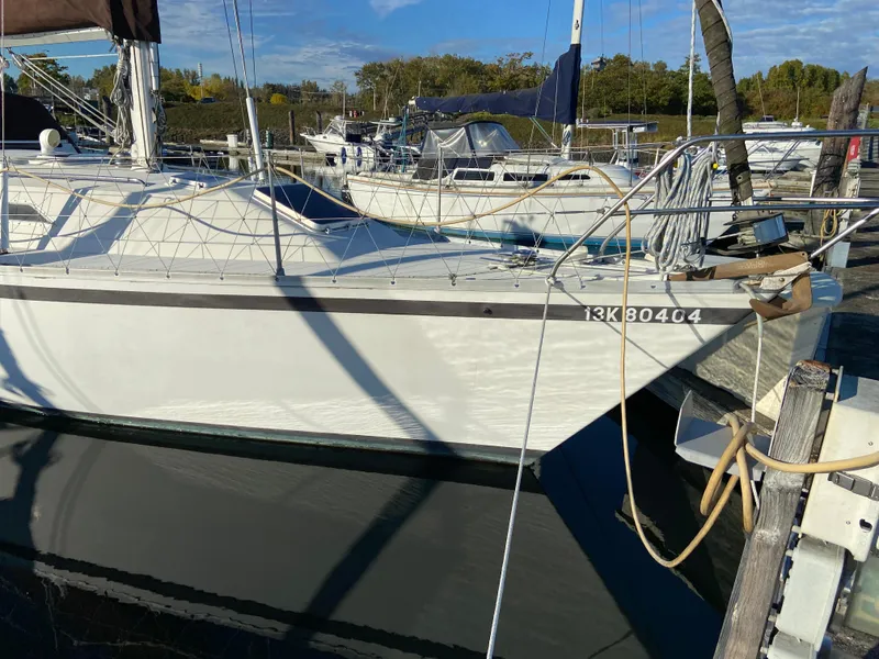 Slide: The Image of 1981 CS 33 sailboat docked at marina. - 13