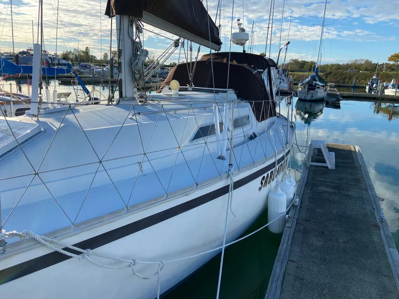 Slide: The Image of 1981 CS 33 sailboat docked in marina. - 17