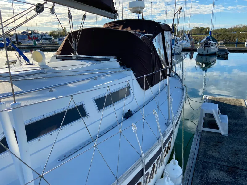 Slide: The Image of 1981 CS 33 sailboat docked in marina. - 39