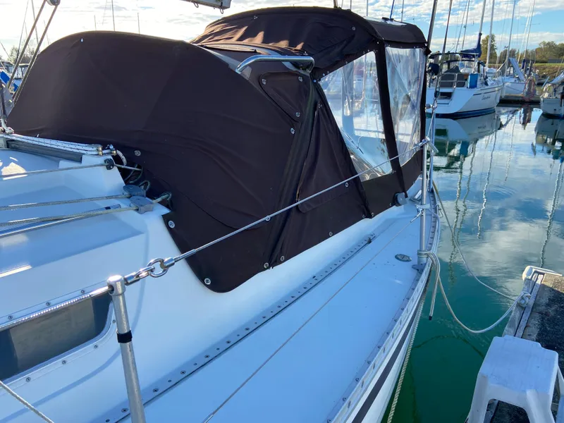 Slide: The Image of 1981 CS 33 sailboat docked in marina. - 40