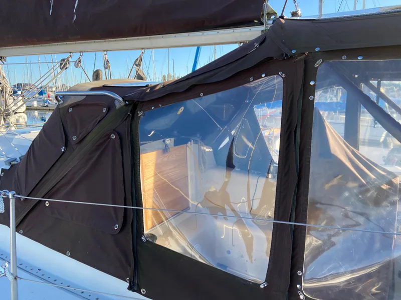 Slide: The Image of 1981 CS 33 sailboat with black canopy in harbor. - 43