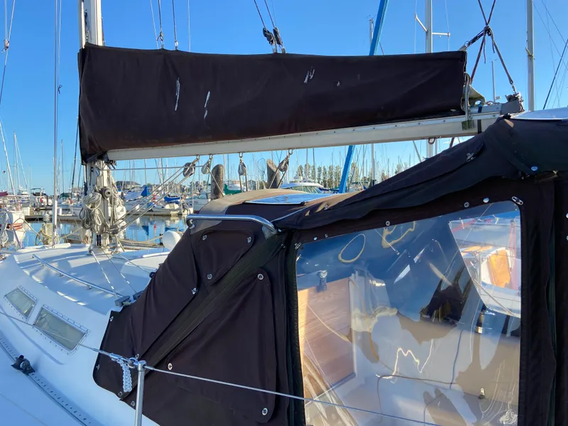 Slide: The Image of 1981 CS 33 sailboat in harbor with black cover. - 44