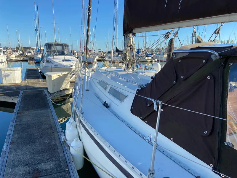 Slide: The Image of 1981 CS 33 sailboat docked in marina. - 46
