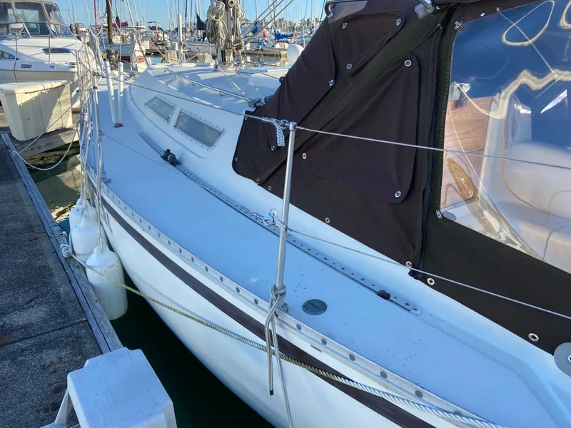 Slide: The Image of 1981 CS 33 sailboat docked at marina. - 47