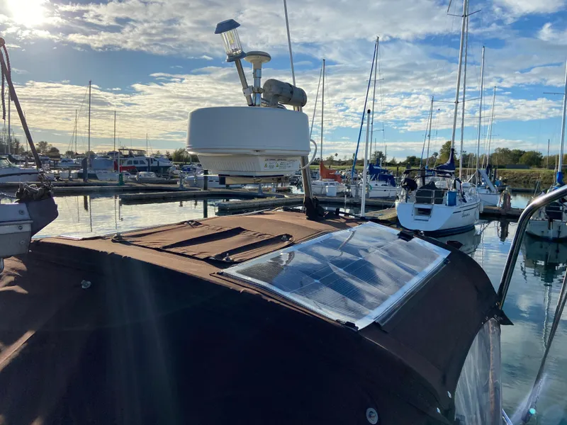 Slide: The Image of 1981 CS 33 sailboat in marina with solar panel. - 49