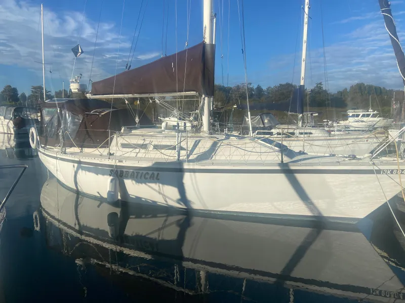 Slide: The Image of 1981 CS 33 sailboat docked in harbor, calm waters. - 5