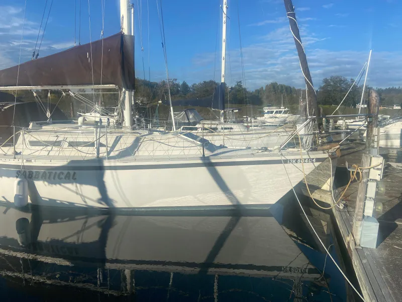 Slide: The Image of 1981 CS 33 sailboat docked in harbor on a sunny day. - 6