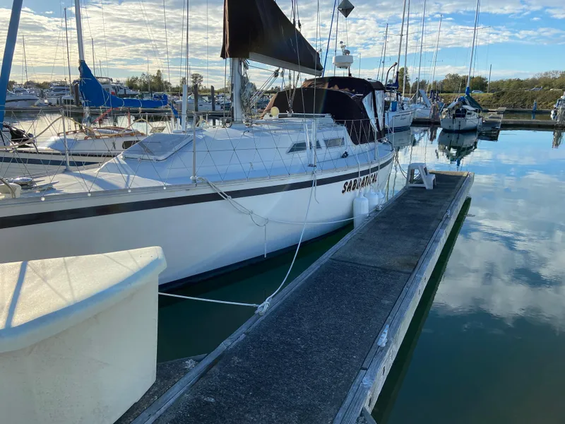 Slide: The Image of 1981 CS 33 sailboat docked in marina. - 7