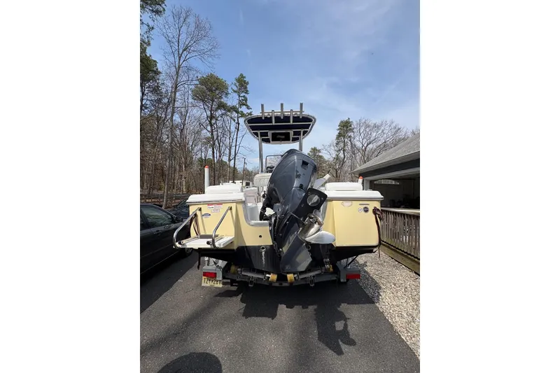 Slide: The Image of 2014 Sea Hunt Triton 202 boat on trailer, parked outdoors. - 6