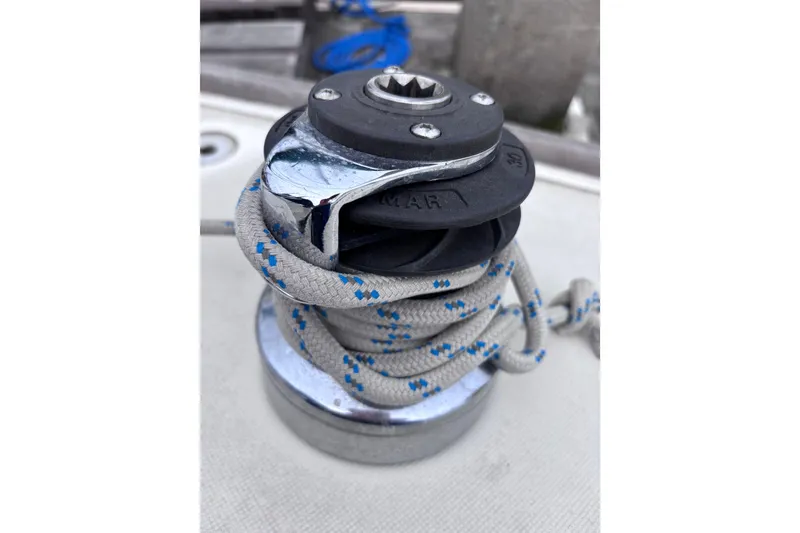 Slide: The Image of Winch with rope on a 1986 Pearson 28 sailboat deck. - 24