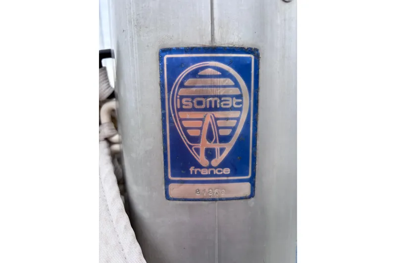 Slide: The Image of Blue Isomat France logo on a Pearson 28 sailboat mast, 1986 model. - 25