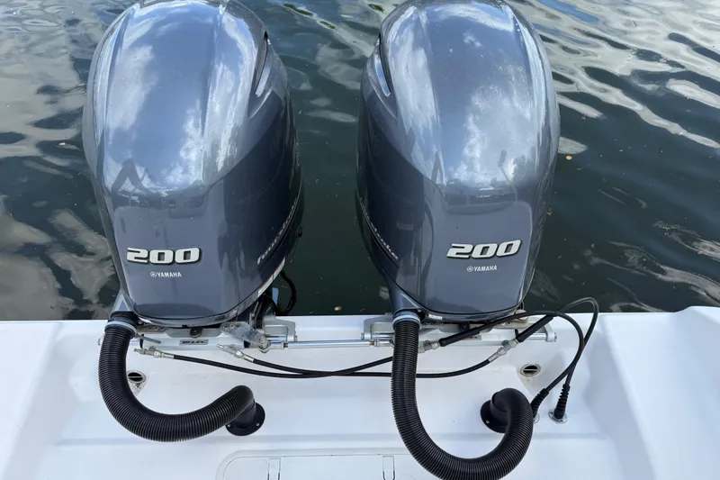 Slide: The Image of Twin Yamaha 200 outboard motors on a 2022 Century 2600 Center Console boat. - 12