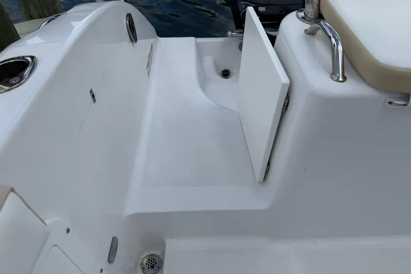 Slide: The Image of 2022 Century 2600 Center Console boat interior with seating and storage compartment. - 13
