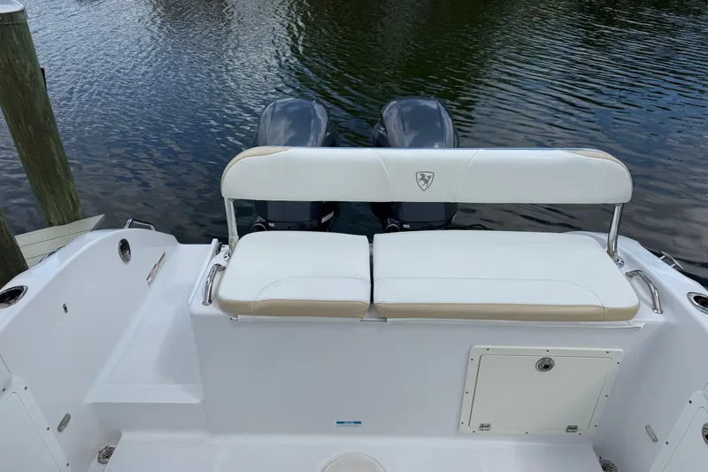Slide: The Image of 2022 Century 2600 Center Console boat with dual engines and white seating. - 15