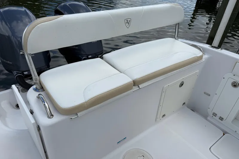 Slide: The Image of 2022 Century 2600 Center Console boat with dual engines and cushioned seating. - 16