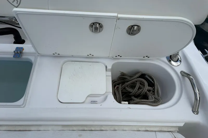Slide: The Image of Storage compartment on a 2022 Century 2600 Center Console boat with rope inside. - 20