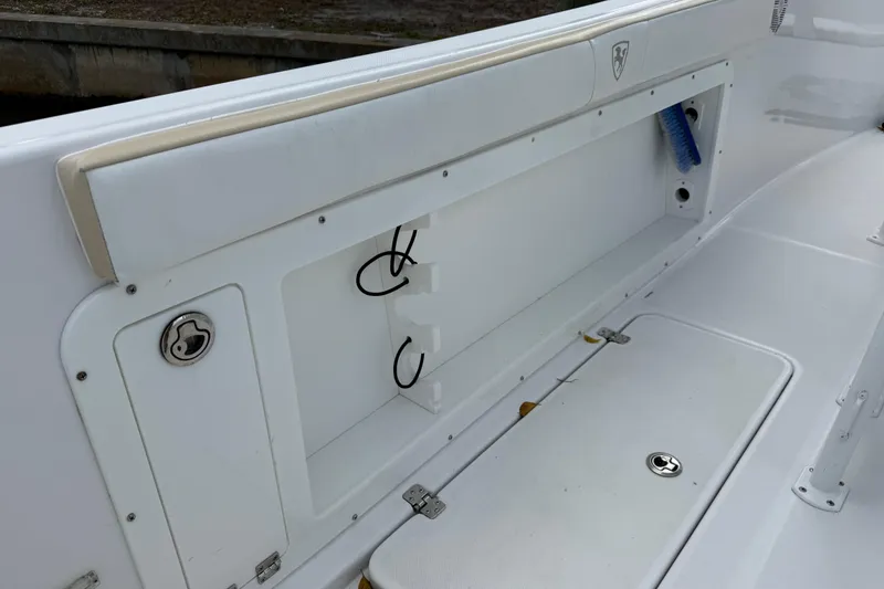 Slide: The Image of 2022 Century 2600 Center Console boat interior with storage compartments and hooks. - 21