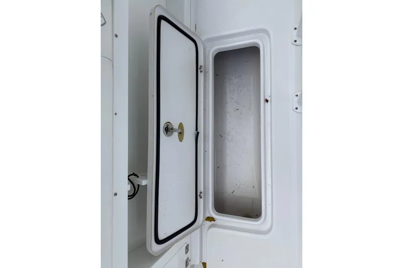 Slide: The Image of Open storage compartment on a 2022 Century 2600 Center Console boat. - 22