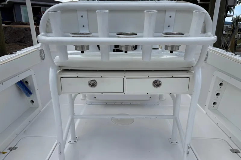 Slide: The Image of 2022 Century 2600 Center Console boat interior with rod holders and storage drawers. - 25