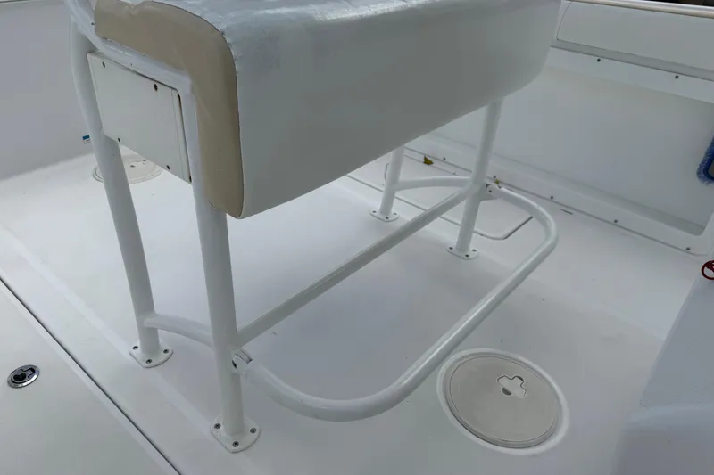 Slide: The Image of 2022 Century 2600 Center Console boat interior with white seating and deck. - 28