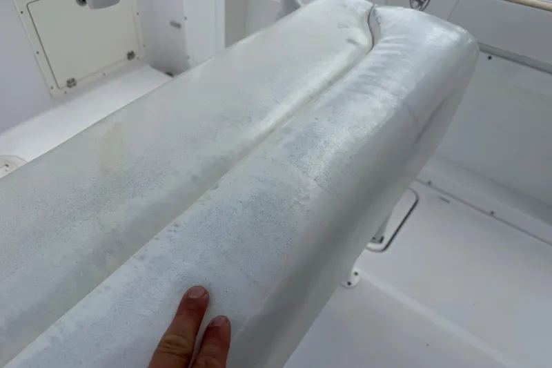 Slide: The Image of Worn seat cushion on 2022 Century 2600 Center Console boat interior. - 29
