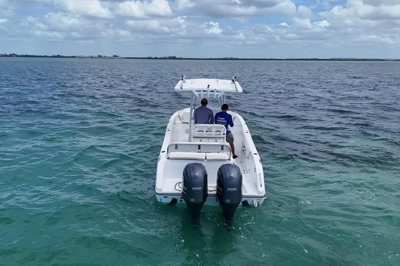 Slide: The Image of 2022 Century 2600 Center Console boat on open water, two people aboard. - 3