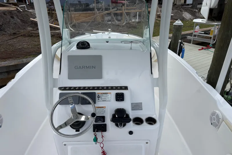 Slide: The Image of Century 2600 Center Console 2022 boat dashboard with Garmin navigation system. - 31
