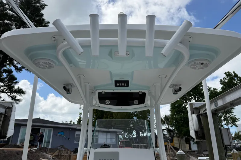 Slide: The Image of 2022 Century 2600 Center Console boat with rod holders and speakers under T-top. - 32