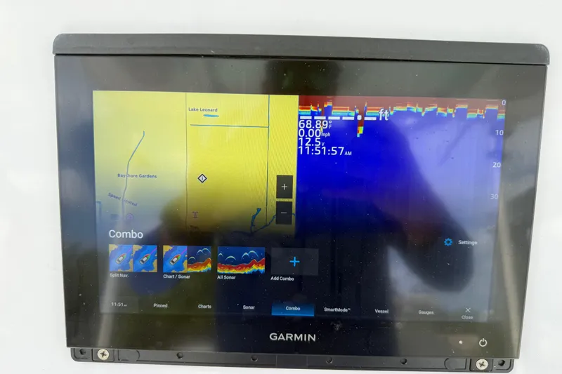 Slide: The Image of Garmin marine display on 2022 Century 2600 Center Console showing sonar and navigation data. - 34