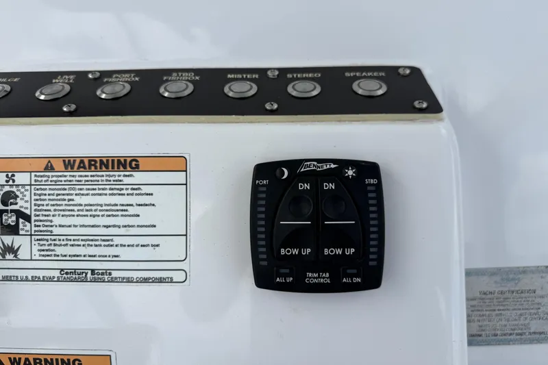 Slide: The Image of Control panel of a 2022 Century 2600 Center Console boat with warning labels. - 38