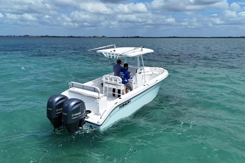 Slide: The Image of 2022 Century 2600 Center Console boat cruising on clear blue ocean waters. - 4