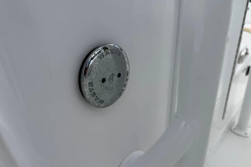Slide: The Image of Chrome waste cap on 2022 Century 2600 Center Console boat. - 40