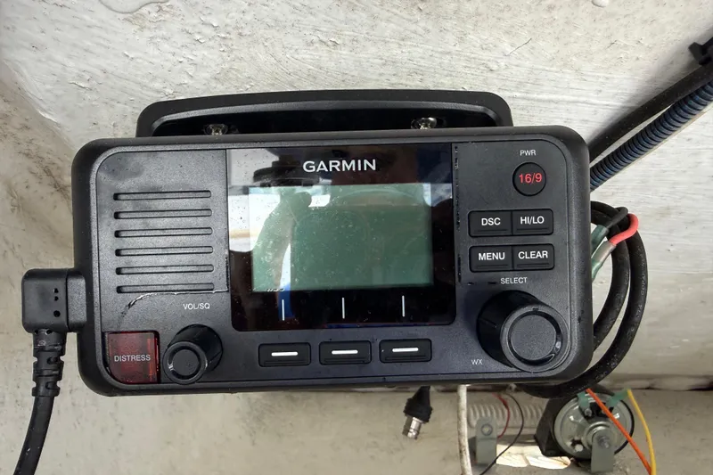 Slide: The Image of Garmin marine radio on 2022 Century 2600 Center Console boat dashboard. - 42