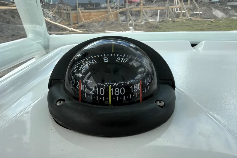 Slide: The Image of Compass on 2022 Century 2600 Center Console boat dashboard, showing direction. - 43