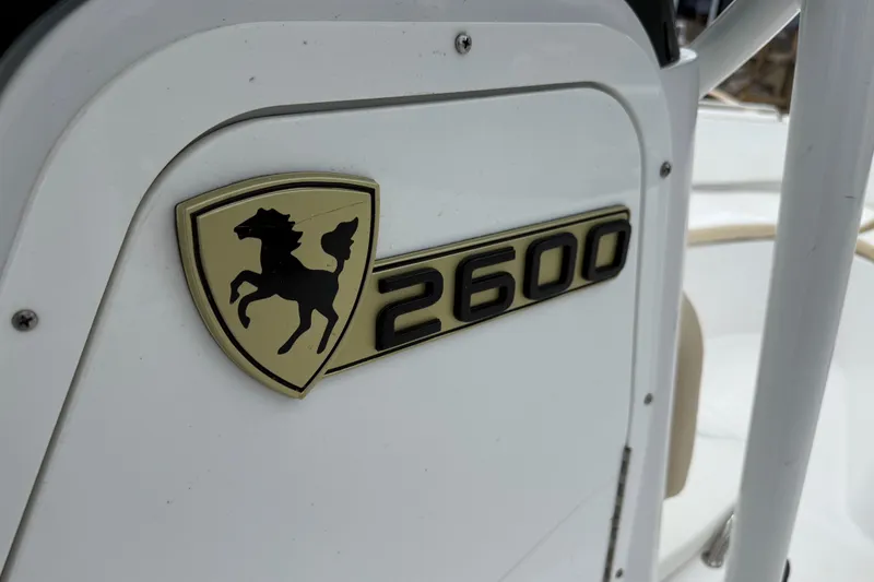 Slide: The Image of 2022 Century 2600 Center Console boat emblem with horse logo. - 44
