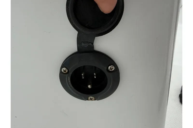 Slide: The Image of Close-up of a 2022 Century 2600 Center Console boat's electrical outlet. - 47