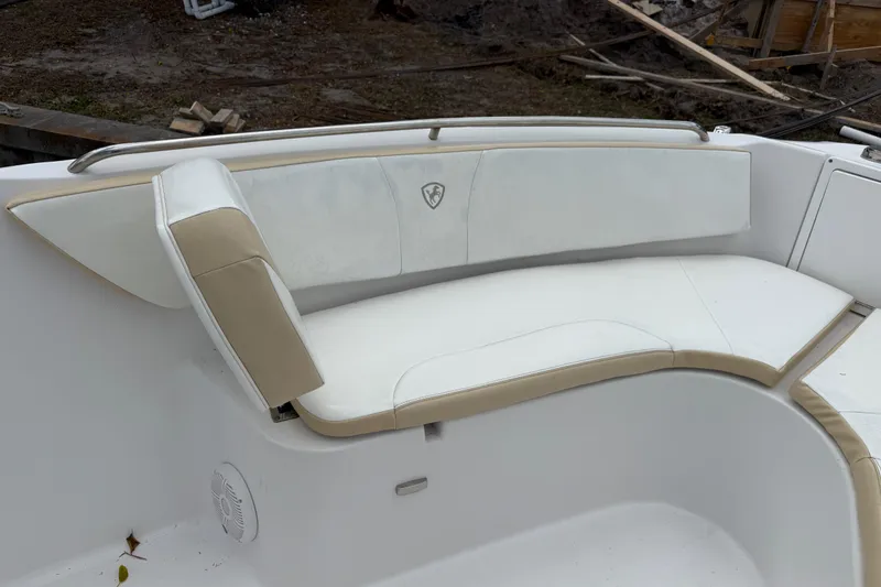 Slide: The Image of 2022 Century 2600 Center Console boat seating area with beige and white cushions. - 50