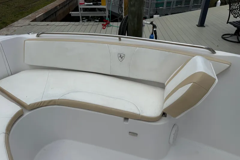 Slide: The Image of 2022 Century 2600 Center Console boat with white and beige cushioned seating. - 51