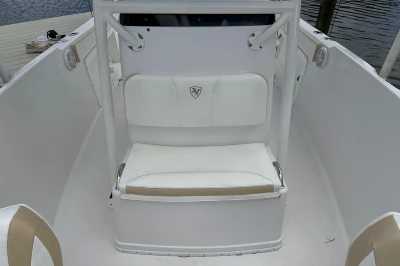 Slide: The Image of 2022 Century 2600 Center Console boat interior with white seating and console. - 52
