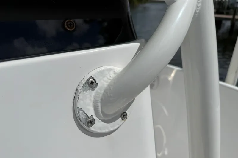 Slide: The Image of Close-up of a 2022 Century 2600 Center Console boat's railing and mounting detail. - 54