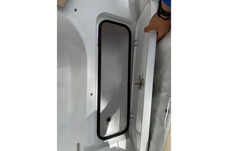 Slide: The Image of Open storage compartment on a 2022 Century 2600 Center Console boat. - 57